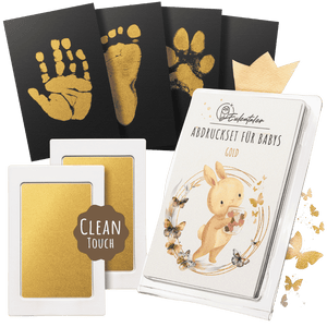 Eulentaler Clean-Touch-Abdrucksets für Babys mit schwarzen und goldenen Stempelkissen sowie Karten für Hand- und Fußabdrücke ohne direkten Farbkontakt.
