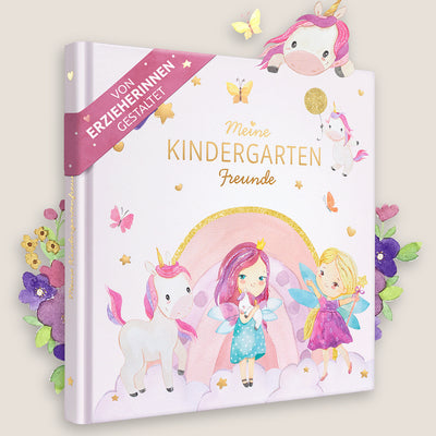 Ein rosa Kindergartenfreundebuch mit dem Titel "Meine Kindergarten Freunde" und Illustrationen von Einhörnern, Feen und einem Regenbogen. Das Buch hat goldene Akzente und ein rosa Band mit deutschem Text.