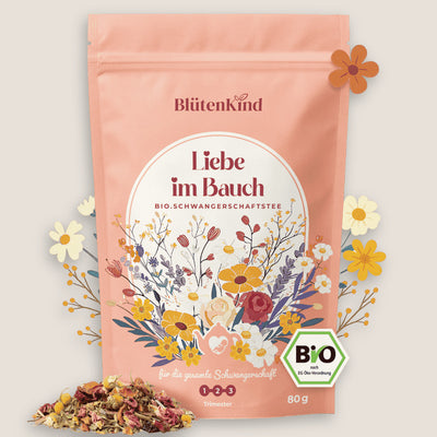 Blütenkind Bio-Schwangerschaftstee „Liebe im Bauch“ in rosa Verpackung mit floralem Design, Bio-Siegel und loser Kräuterteemischung für alle drei Trimester.
